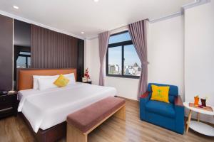 Ένα ή περισσότερα κρεβάτια σε δωμάτιο στο The Palms Hotel