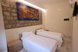 Кровать или кровати в номере Albergo Peluso