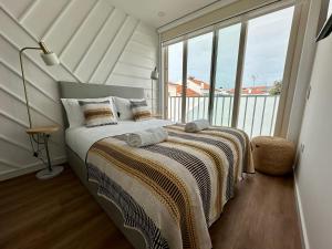 En eller flere senge i et værelse på Alentejo Charm House