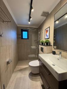 a bathroom with a white toilet and a sink at Villa Maria Luxury in Kamala Beach +33 photos