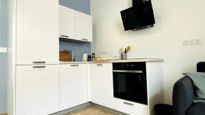 Η κουζίνα ή μικρή κουζίνα στο 21 rue Thiers