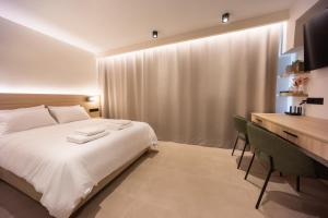 Кровать или кровати в номере Urban Suite Trikala +13 фотографий