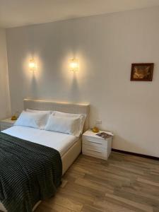 Giường trong phòng chung tại Residence Principe di Saronno