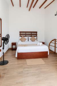 Ένα ή περισσότερα κρεβάτια σε δωμάτιο στο Road House Ella