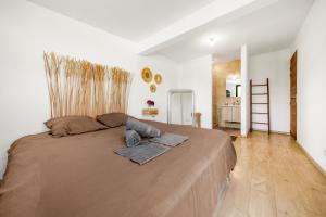 Postel nebo postele na pokoji v ubytování Villa Rêve Austral + 7 fotografií