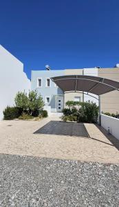 a building with a pavilion in front of it at Gennadi Villa Mary in Gennadi