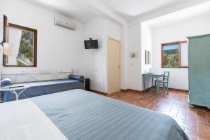 Ένα ή περισσότερα κρεβάτια σε δωμάτιο στο Poggio di Peschici by Perle di Puglia