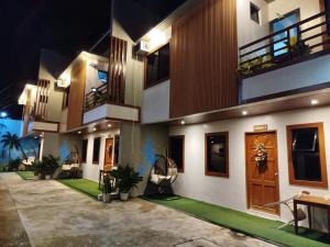 a house with a courtyard at night at BALAI MALINAWON Hotel 3 in General Luna