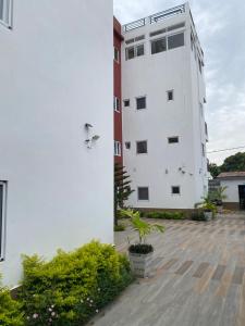 a white building with a bird on the side of it at Comfort Corner in Amdalai +2 photos