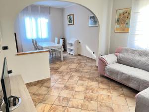 a living room with a couch and a table at Casa Mary in Domodossola