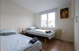 Ένα ή περισσότερα κρεβάτια σε δωμάτιο στο Family & Worker Accommodations in Göteborg