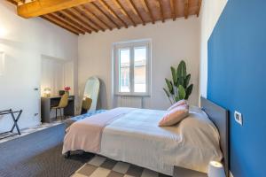 Ένα ή περισσότερα κρεβάτια σε δωμάτιο στο Heart Of Pisa