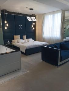 Ένα ή περισσότερα κρεβάτια σε δωμάτιο στο Z Rooms Boutique Smart Hotel, személyzet nélkül