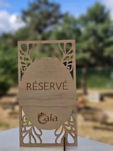 a sign that says preserve calita sitting on a table at ZEcamping 3 étoiles vue lac environnement calme in Douville