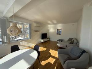 a living room with a table and a couch at Sallinnguit in Sisimiut
