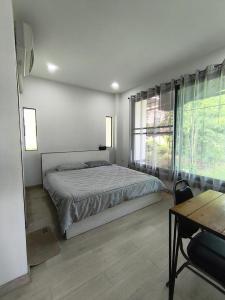 Ένα ή περισσότερα κρεβάτια σε δωμάτιο στο Mind house