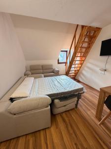 a large bed in a room with a staircase at Increíbles vistas en el corazón de Formigal - Esquía sin llaves in Formigal