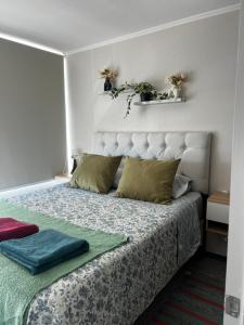 Ένα ή περισσότερα κρεβάτια σε δωμάτιο στο Nuevo departamento rancagua