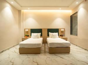 Ένα ή περισσότερα κρεβάτια σε δωμάτιο στο Lotus Vista