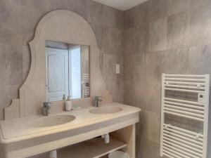 a bathroom with two sinks and a mirror at Les Hauteurs du Luberon in Caseneuve +43 photos