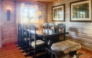 a dining room with a table and chairs at Stunning Home In Ljørdalen With Sauna in Ljørdalen