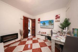 a living room with a checkered floor at Tropical Elegance in central Panglao ! in Panglao