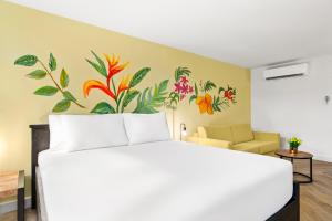 Postel nebo postele na pokoji v ubytování Parasasa Hotel Curacao