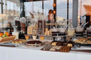 a buffet of desserts and pastries on a table at The Rest Port Hotel in Edirne