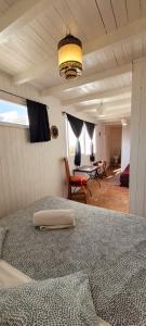 a bedroom with a bed and a table in a room at Riad Ocean Medina in Essaouira