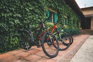 two bikes are parked next to a building at HolaCamp Camino Apartamentos Turísticos in O Pino 
