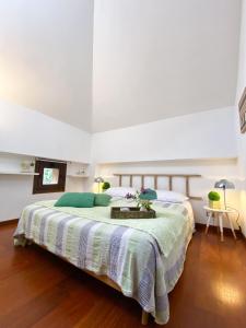 a bedroom with a large bed with a table on it at Il camino felice - 201 by Houset in Monza