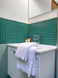 a bathroom with a sink and a white towel at Il camino felice - 201 by Houset in Monza