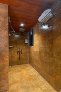 a bathroom with a cross on the wall and a light at Sumitel Vista 800m from Mall Road in Darjeeling +91 photos