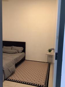 Postel nebo postele na pokoji v ubytování D' Ara SZ Homestay + 4 fotografie