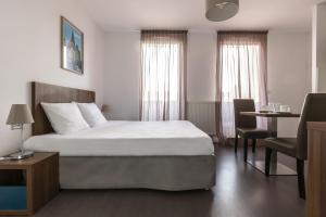 Giường trong phòng chung tại Appart Hotel Odalys City Metz Manufacture +53 ảnh