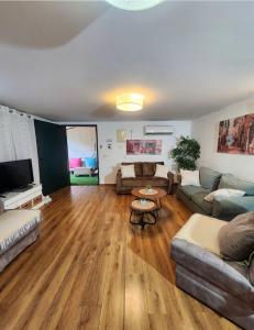 a living room with a couch and a table at צימר חן בחד נס in Had Nes