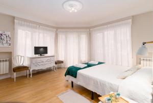 Ένα ή περισσότερα κρεβάτια σε δωμάτιο στο Apartamento CRISTINA en el CENTRO