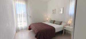 En eller flere senge i et værelse på Ático Ancla + 26 billeder