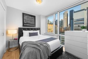 Кровать или кровати в номере Synergy Chelsea