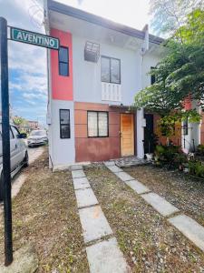 a street sign in front of a house at JOs HOMEtel at Heritage City of the South Carcar in Guinauayan +34 photos