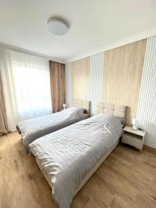 Postel nebo postele na pokoji v ubytování Apartament DanHouse 5 + 4 fotografie