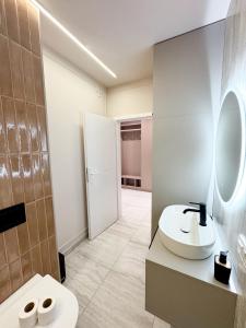 a bathroom with a sink and a toilet at Sky Escape - Private Parking, Kingsize Bed & More in Cluj-Napoca +16 photos