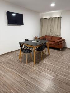 TV a/nebo společenská místnost v ubytování Edificio Pacha