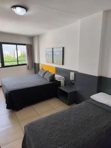 Ένα ή περισσότερα κρεβάτια σε δωμάτιο στο Apart Hotel Alvear