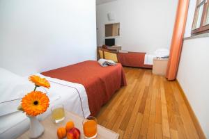 Ένα ή περισσότερα κρεβάτια σε δωμάτιο στο Hotel la Colonna Siena +51 φωτογραφίες