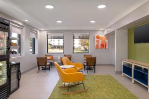 a waiting room with chairs and a table at Spark by Hilton Fishkill in Fishkill
