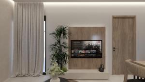 TV a/nebo společenská místnost v ubytování NAMA Suites