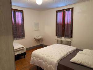 Voodi või voodid majutusasutuse Gîte Crèmouille toas