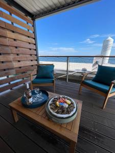 a tray of food on a table on a deck at Les Ilots de Gruissan in Gruissan