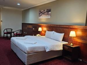 Ένα ή περισσότερα κρεβάτια σε δωμάτιο στο فندق وفاق صدقي +22 φωτογραφίες